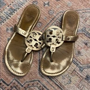 Well worn Tory Burch flip flops
